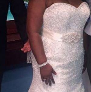 Wedding dress with all undergarments and veil.